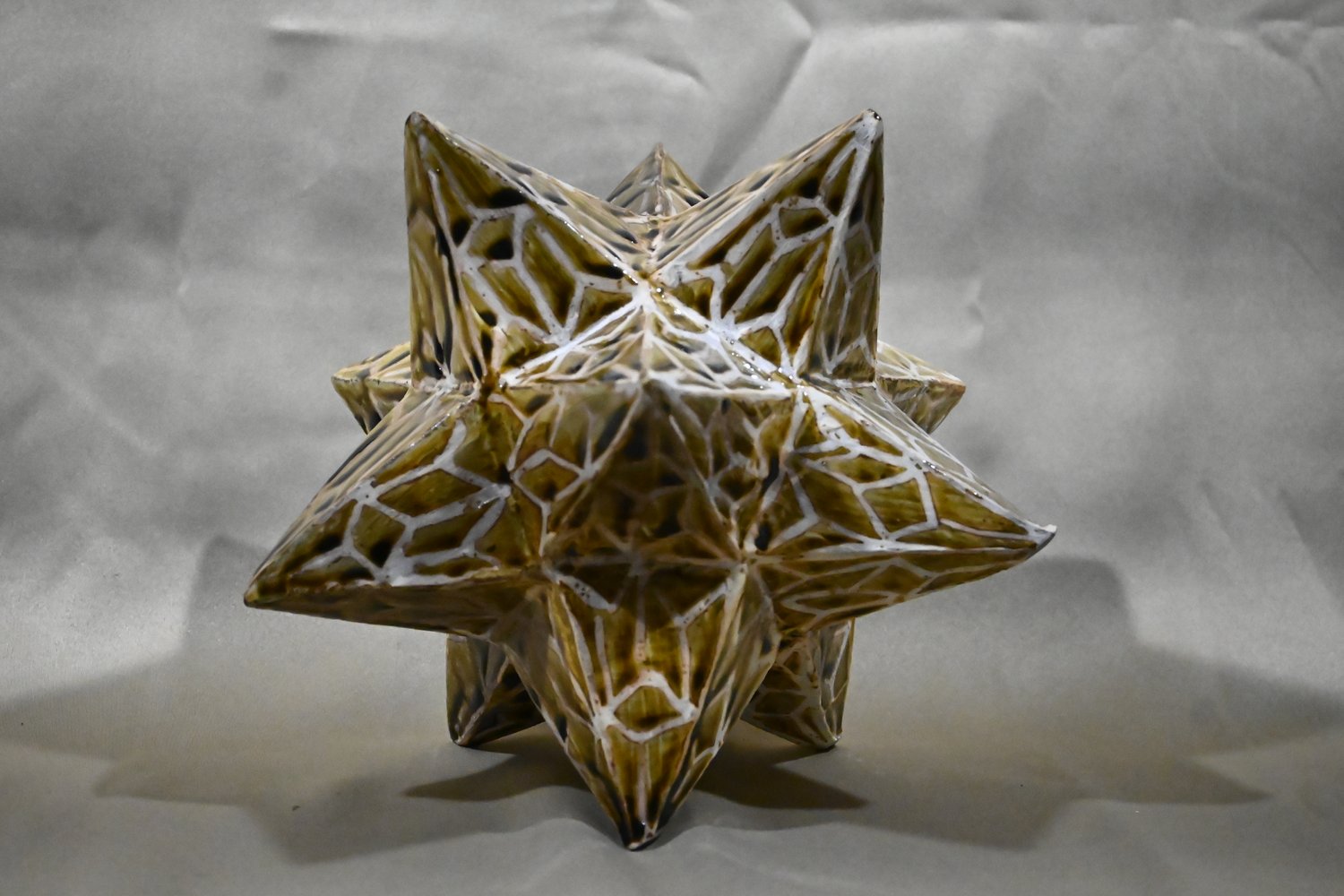 amber yellow brown colored dodecahedron shaped ceramic sculpture