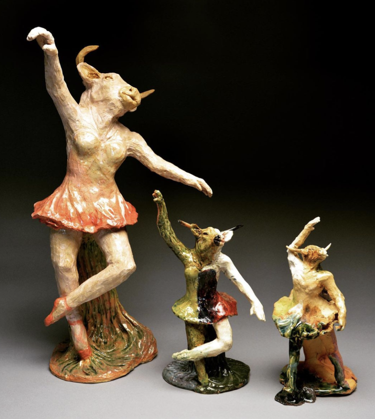 ceramic statue of a ballerina with a bull head pink